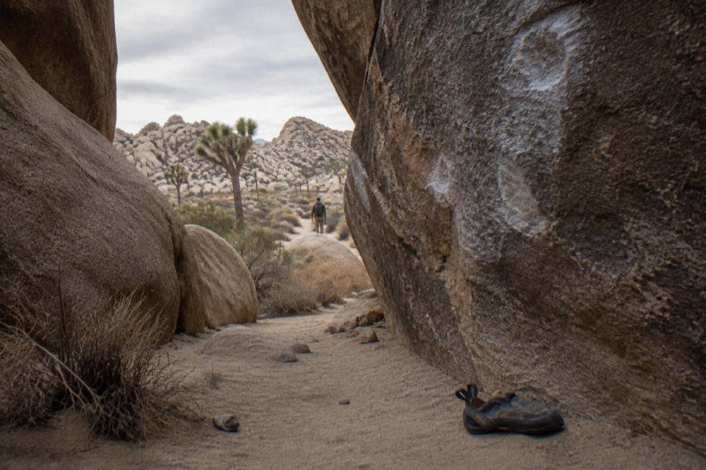 Massive stacked granite boulders forming caves and corridors in the desert